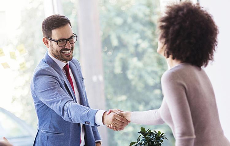 Salesperson shaking hands with customer