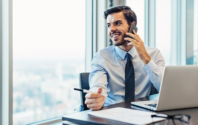 Man talking on the phone while seated