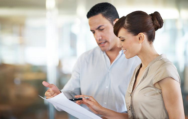 Two colleagues looking at something