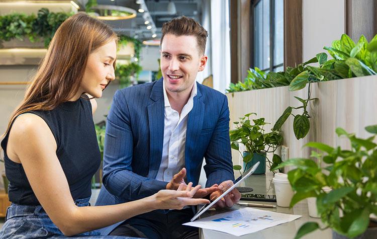 Two colleagues discussing a contract